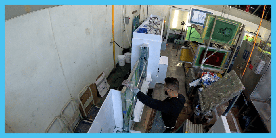 Bluewater Labs automated screen reclaim machine in commercial screen printing shop
