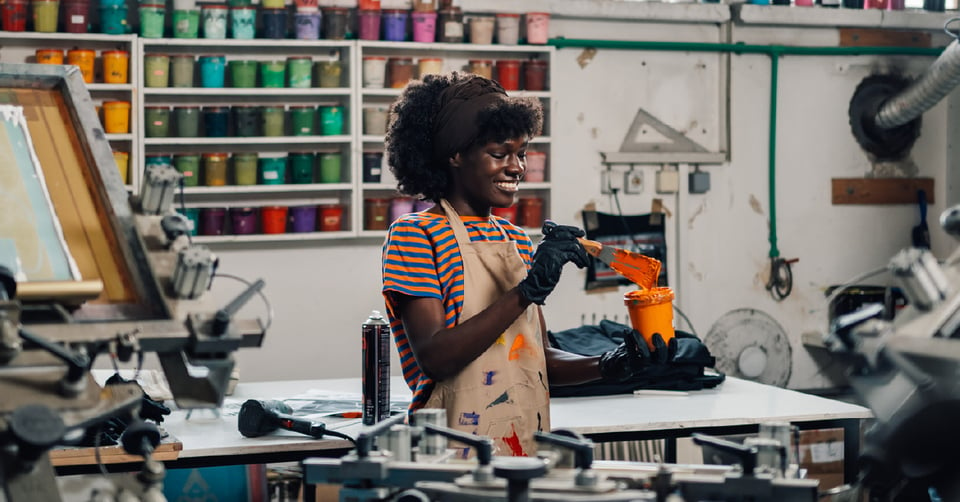 Woman working in her print shop 